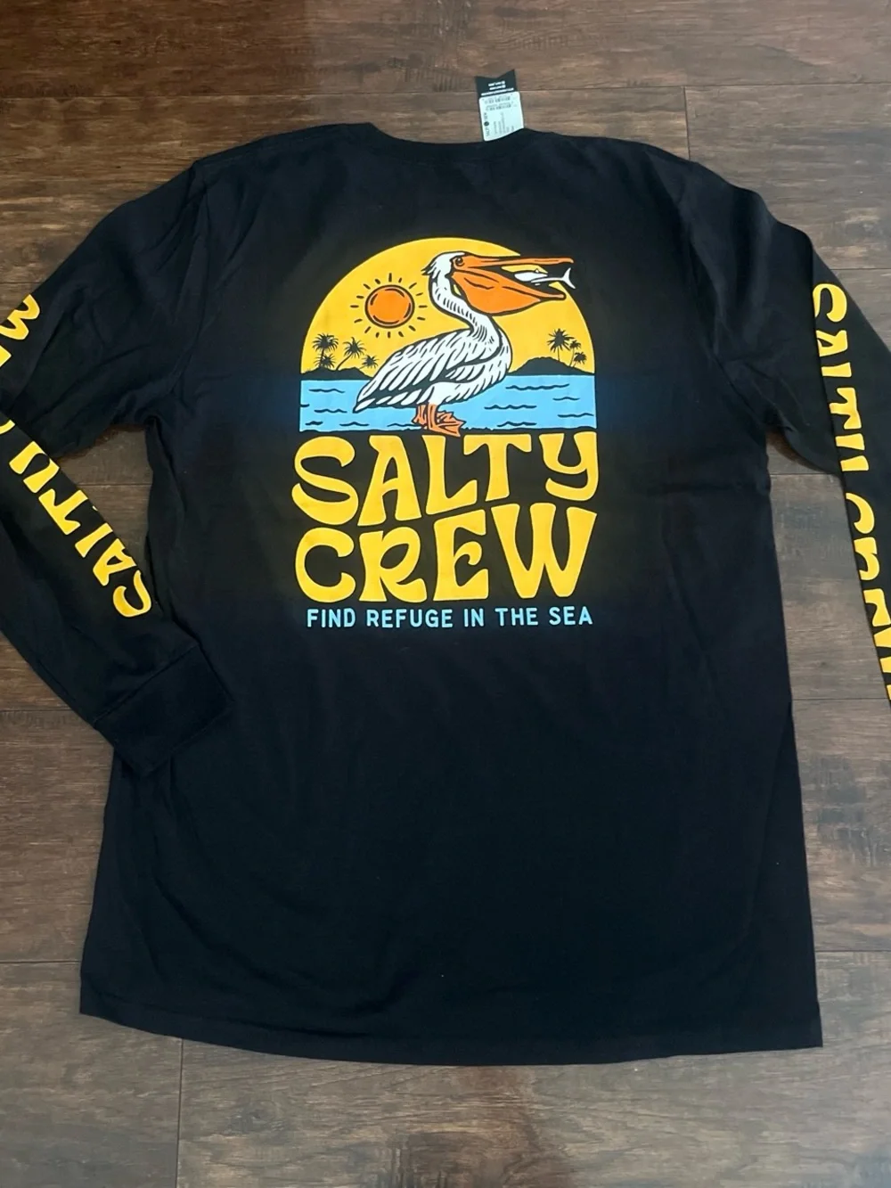 Salty Crew Black Long Sleeve Swim Tee with Yellow & Blue Pelican Graphic